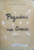 PEGADAS NA AREIA.
